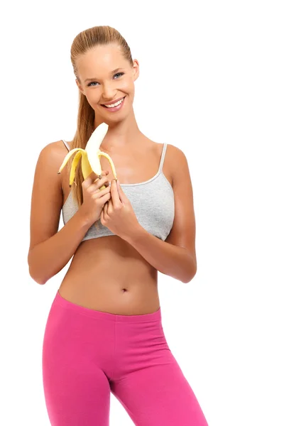 Счастливая женщина с бананом на белом фоне — стоковое фото