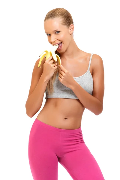 Blonde woman eating banana Stock Image