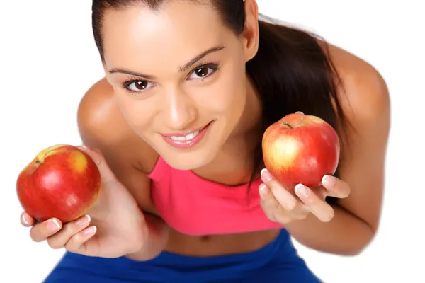 Closeup portrait of a brunette teenager with apples — Stock Photo, Image