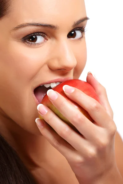 Closeup portrait of a teenager taking a bite of an apple Stock Image