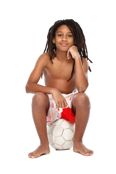 Portrait of a rasta guy sitting on football — Stock Photo, Image