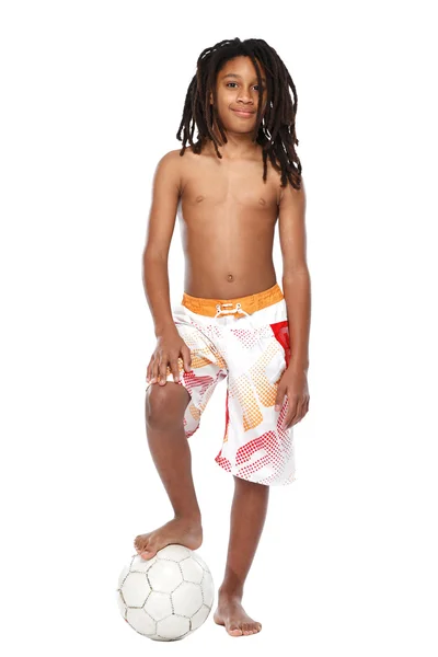 Young rasta guy with football in studio — Stock Photo, Image