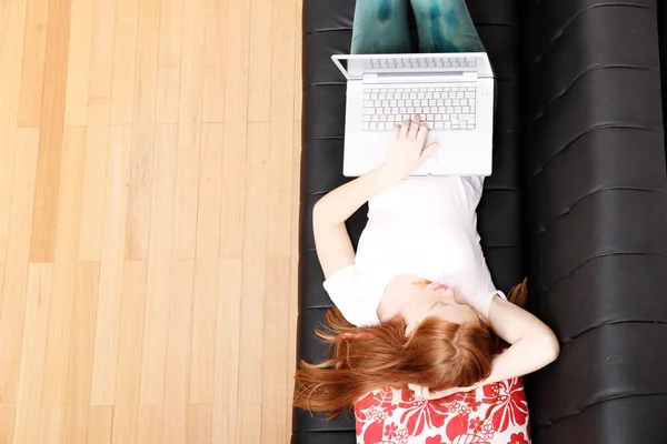 Young Redhead Girl with a Laptop — Stock Photo, Image