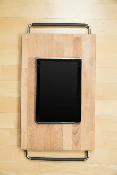 Tablet PC on a cutting board — kuvapankkivalokuva