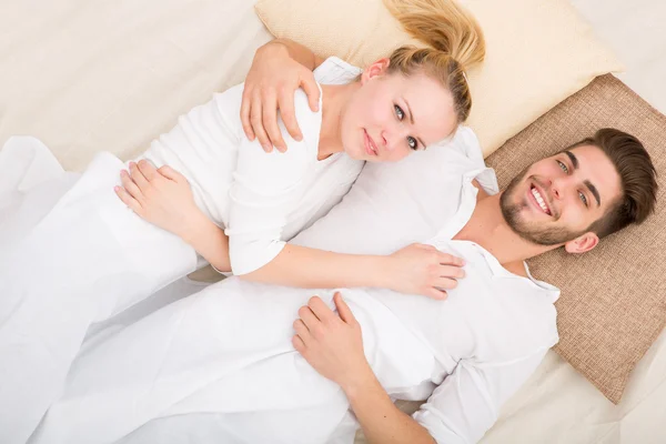 Happy young couple in Bed — Stock Photo, Image