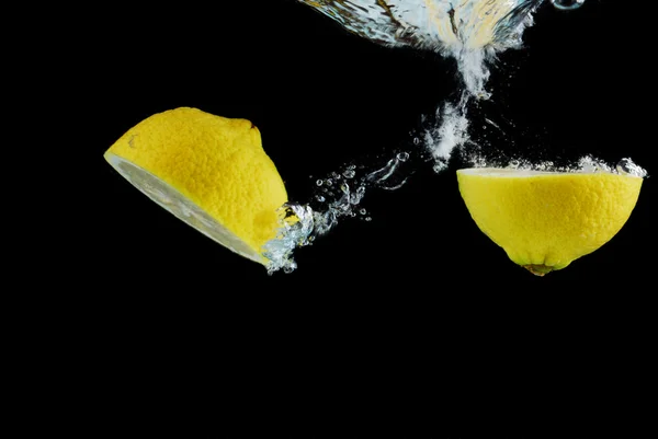 Slice of lemon with water drops — Stock Photo, Image