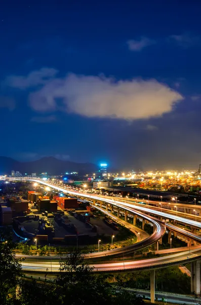 Overpass bridge and pier in night — Stock Photo, Image