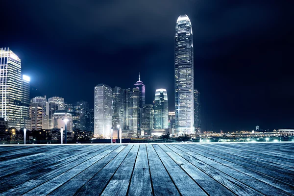 Wooden platform and city — Stock Photo, Image