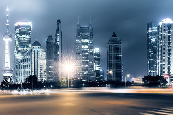 The light trails on the modern building background in shanghai china