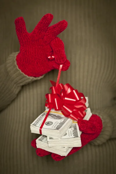 Woman Wearing Mittens Holding Stacks of Money with Red Ribbon — Stok fotoğraf