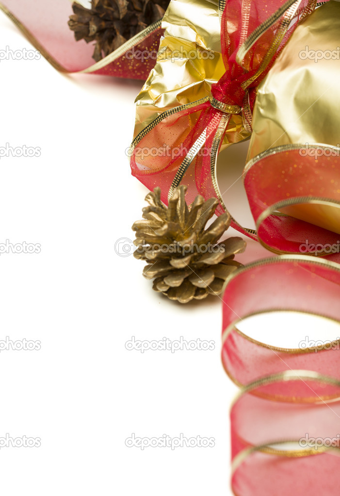 Christmas Present with Red Ribbon and Pine Cones on White