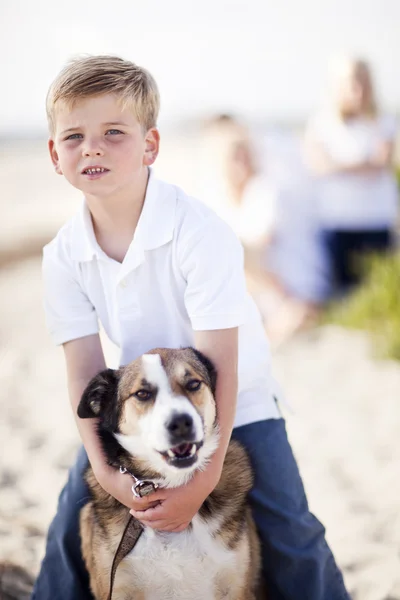 Handsome Young Boy Playing with His Dog Royalty Free Stock Images