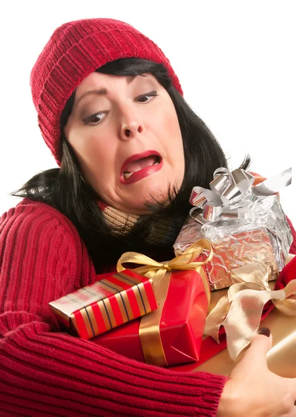 Atractiva mujer tropezando con sus regalos de vacaciones —  Fotos de Stock