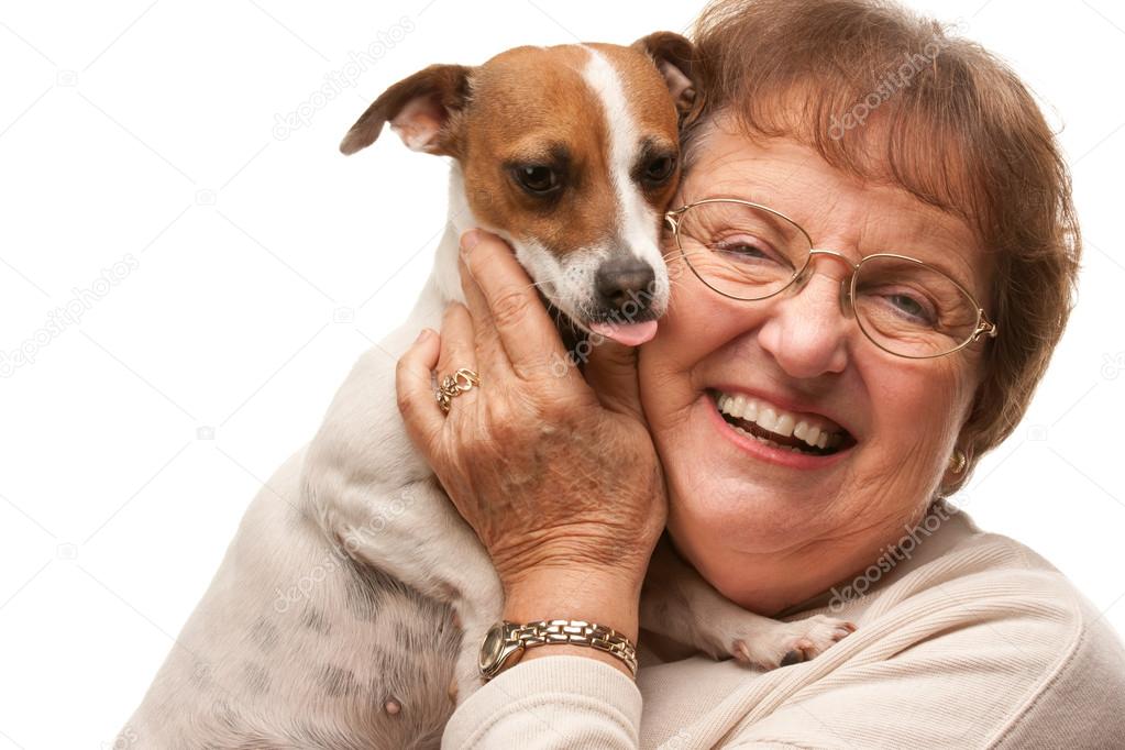 Happy Attractive Senior Woman with Puppy on White