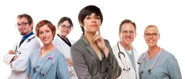 Young Mixed Race Woman with Doctors and Nurses Behind — Stock Photo, Image