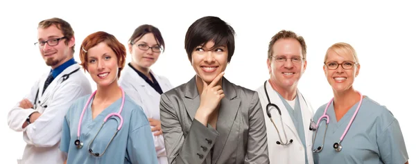 Young Mixed Race Woman with Doctors and Nurses Behind — Stock Photo, Image