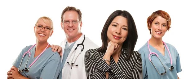 Hispanic Woman with Male and Female Doctors or Nurses Stock Photo