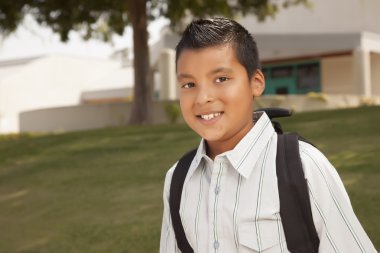 Happy Young Hispanic Boy Ready for School clipart