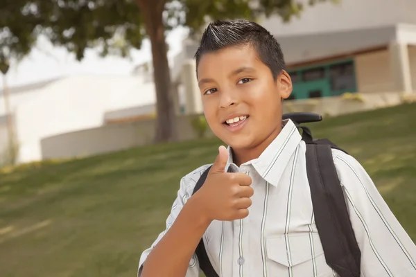 Feliz joven hispano escolar con pulgares hacia arriba —  Fotos de Stock