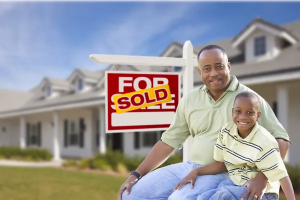 Father and Son In Front of Sold For Sale Sign and House — Stock Photo, Image