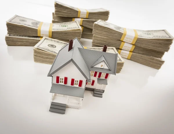 Stacks of Hundreds of Dollars with Small House — Stock Photo, Image