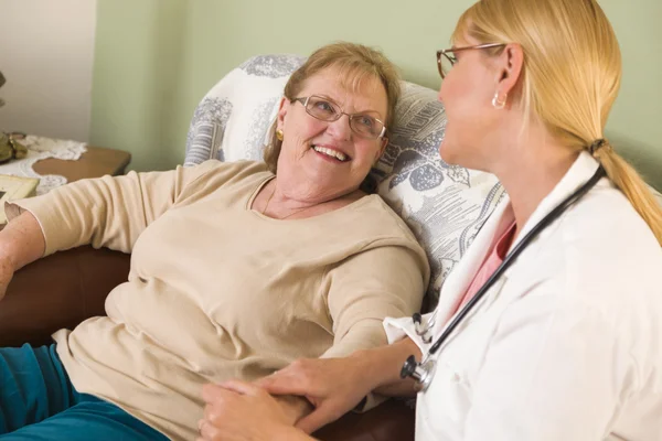 Doctor or Nurse Talking to Sitting Senior Woman — Stock Photo, Image