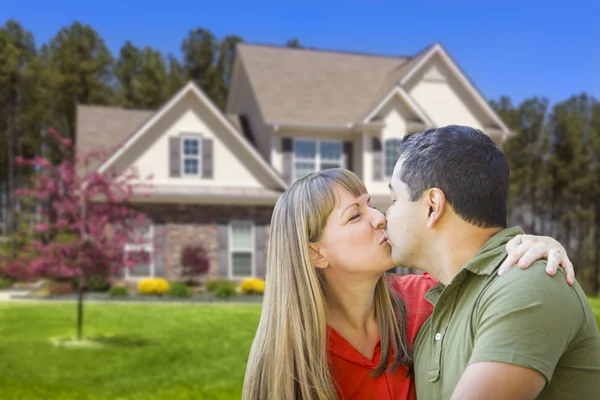Mixed Race Couple Hugging in Front of House — Stock Photo, Image