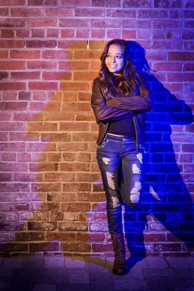 Pretty Mixed Race Young Adult Woman Against a Brick Wall — Stock Photo, Image