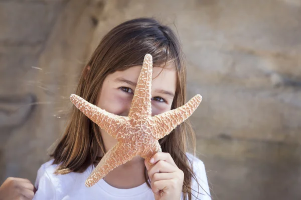 Young Girl Playing with Starfish — Stock Photo, Image