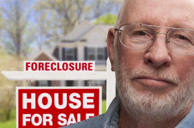 Depressed Senior Man in Front of Foreclosure Sign and House clipart