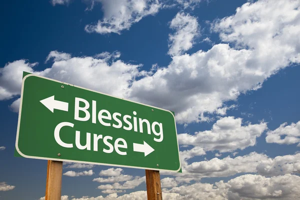 Blessing, Curse Green Road Sign and Clouds — Stock Photo, Image