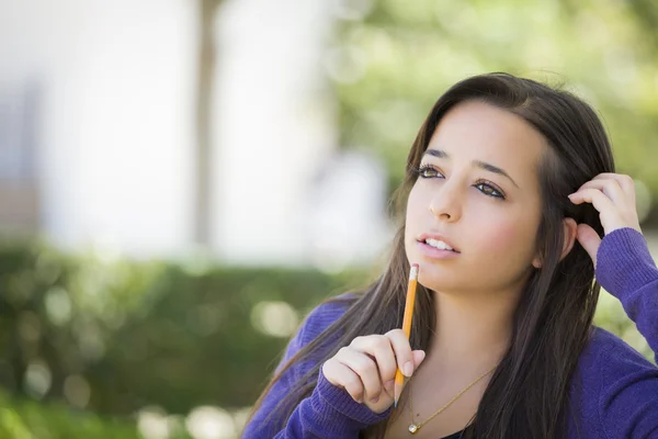 Pensive Mixed Race Female Student with Pencil on Campus — Stock Photo, Image