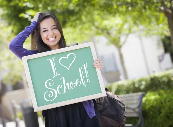 Raza mixta Estudiante femenina sosteniendo pizarra con I Love School — Foto de Stock