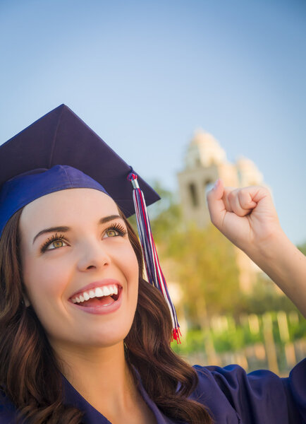 Happy Graduating Mixed Race Woman In Cap and Gown