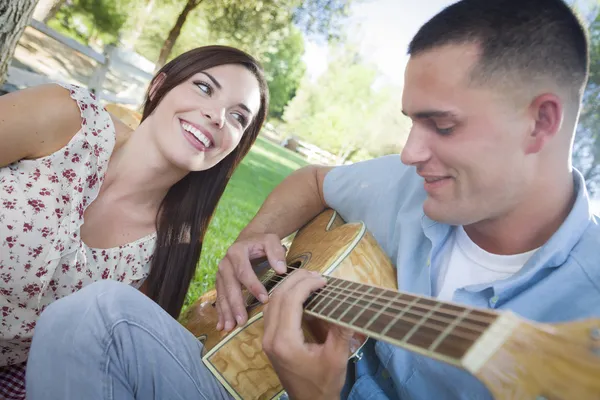 Mixed Race Couple at the Park Playing Guitar and Singing — Stock Photo, Image