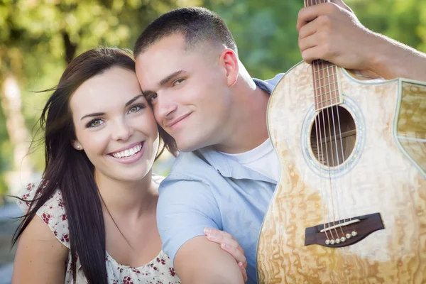 Mixed Race Couple Portrait with Guitar in Park — Stock Photo, Image