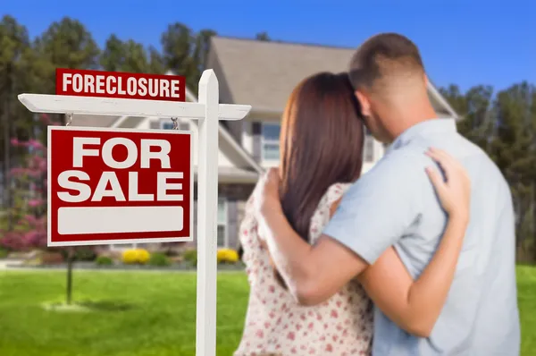Military Couple Standing in Front of Foreclosure Sign and House — Stock Photo, Image