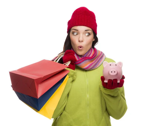 Bevásárló táskák és Piggybank érintett kevert nő — Stock Fotó