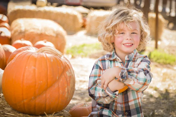 Little Boy Sitting and Holding His Pumpkin at Pumpkin Patc — Stock Photo, Image