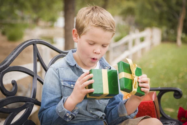 Suprised Young Boy Opens Christmas Gift Outside — Stock Photo, Image