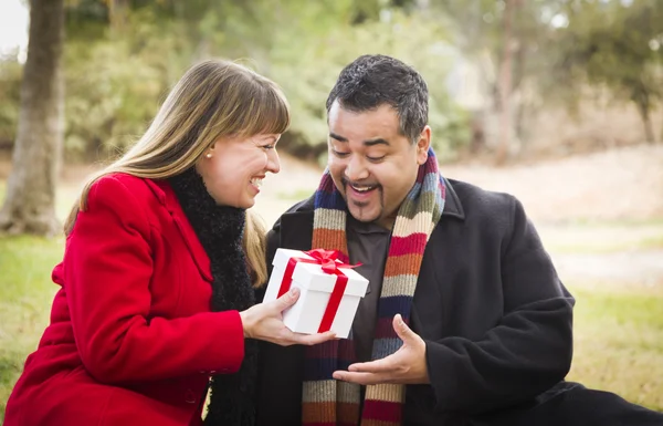 Mixed Race Couple Sharing Christmas or Valentines Day Gift Outsi — Stock Photo, Image