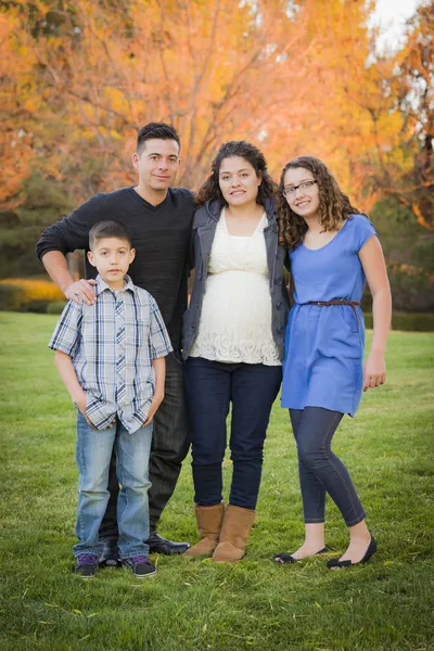 Attractive Hispanic Family Portrait in a Colorful Fall Outdoor S — Stock Photo, Image