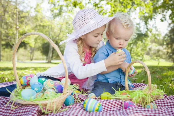 Cute Young Brother and Sister Enjoying Their Easter Eggs Outside — Stock Photo, Image