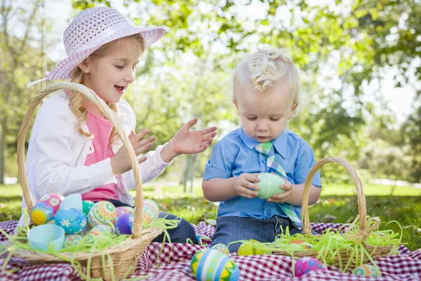 Cute Young Brother and Sister Enjoying Their Easter Eggs Outside — Stock Photo, Image