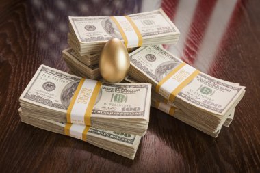 Golden Egg and Thousands of Dollars with American Flag Reflectio clipart