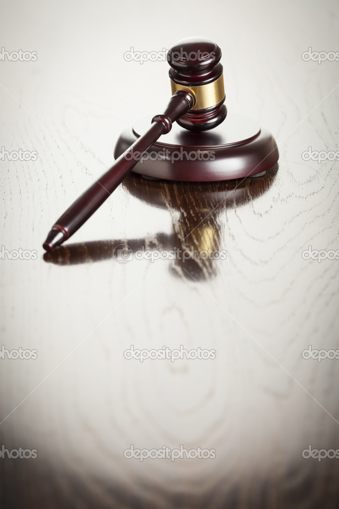 Wooden Gavel Abstract on Reflective Table