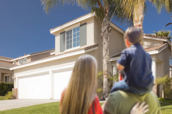 Mixed Race Young Family Looking At Beautiful Home — Stock Photo, Image