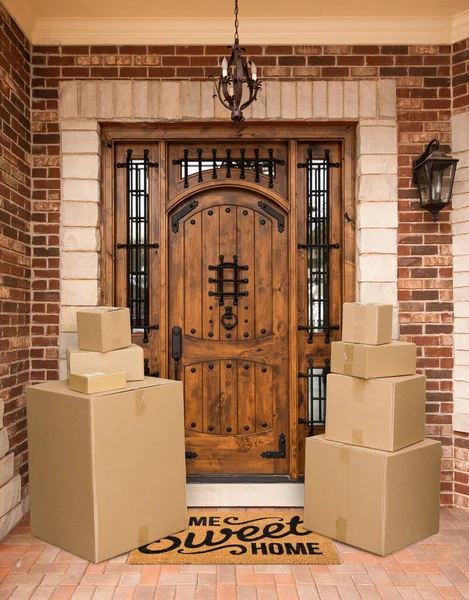 Several Packages Sitting Home Sweet Home Welcome Mat Front Door — Fotografia de Stock