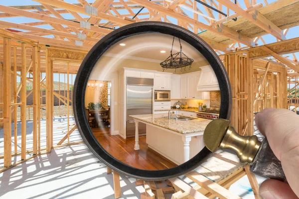 Hand Holding Magnifying Glass Revealing Finished Kitchen Build Construction Framing — Stock Photo, Image