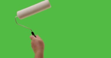 Male Using Paint Roller Two Strokes Across Green Screen.